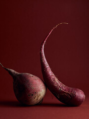 Organic vegetarian food. Abstract food background with beet and radish on red background