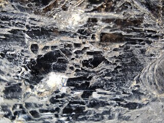 Macrophotography of the textured surface of black morion 5