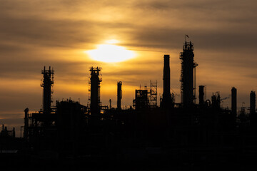 Fototapeta premium Ineos Grangemouth industry complex chimneys fire steam sunset Scotland United Kingdom 