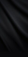 Fototapeta premium Elegant black fabric draped smoothly