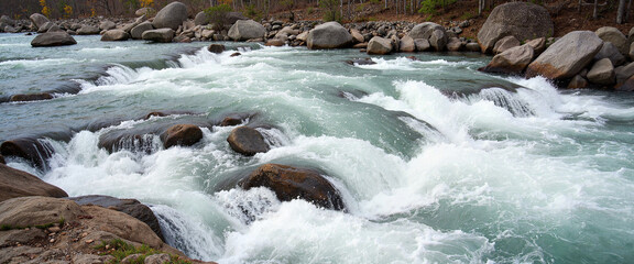 Powerful river rapids rushing over rocky terrain, nature's force
