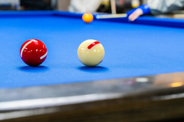 playing billiard on table
