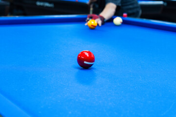 playing billiard on table