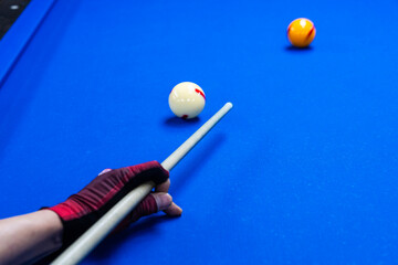 playing billiard on table