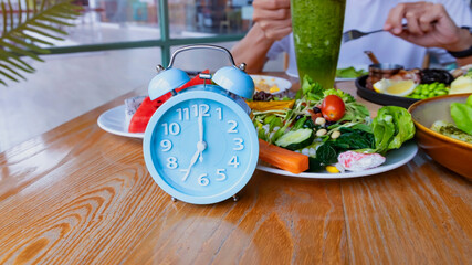Alarm clock with IF (Intermittent Fasting) 16 and 8 diet rule and weight loss concept.-Diet plan concept