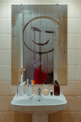 Girl Taking a Selfie in a Foggy Bathroom Mirror with a Smiley Face