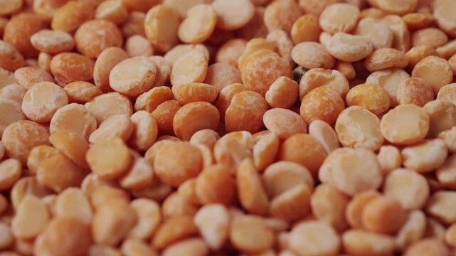 Dried yellow peas close up. Round yellow peas for cooking porridge. Healthy food concept. Healthy nutrition, vegan food. High quality 4k footage