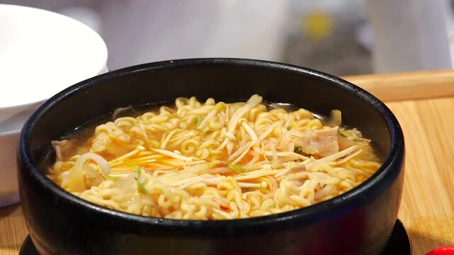 Ramyeon with enoki mushrooms and pork belly