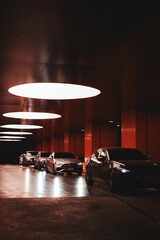 Luxury cars in a modern garage.