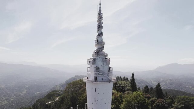 Cinematic Drone 4K. Ambuluwawa Tower is the first Multi Religious Centre in Sri Lanka.There's a Temple, Kovil, Mosque and a Church. The tower is an evocative of a Buddhist 'stupa' with a height of 48m
