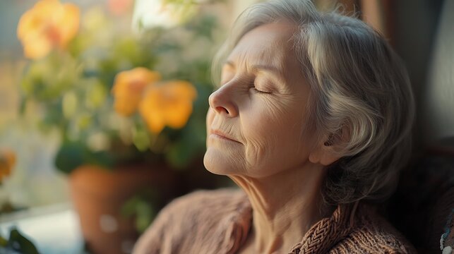 close up senior woman meditating indoors with closed eyes showing serene mindfulness and healthy aging concept high quality photo