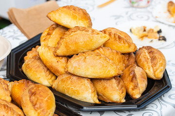 Kibinai, traditional Lithuanian food, pastries filled with various meat, onion and pepper, popular with Karaite ethnic minority in Vilnius, Lithuania, street food market