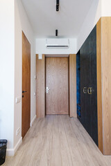a corridor at the entrance to the hotel room