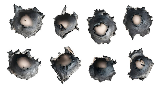 Close-up of eight bullet holes on isolated black background