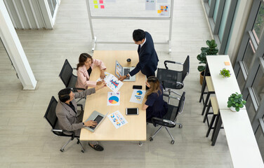 High-powered business professional discussing strategic plan and making decision at a conference...