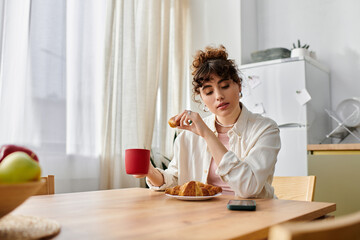 Enjoying a cozy morning with coffee and fresh pastries in a bright kitchen setting