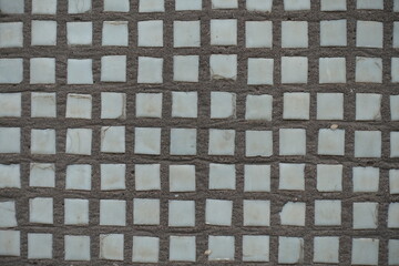Close shot of small white rectangular mosaic tiles