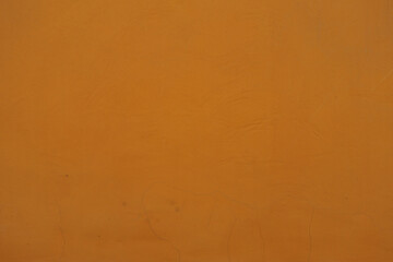 Front view of bright orange painted wall