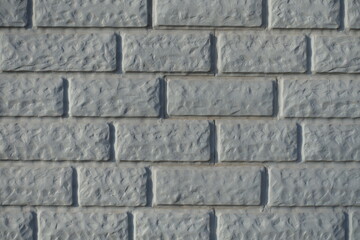 Close up of Light grey painted brick veneer wall