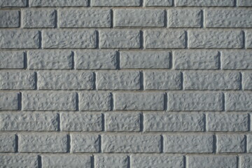 Texture of Light grey painted brick veneer wall