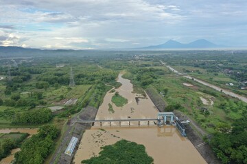 Very nice aerial view of river dam with mountain background