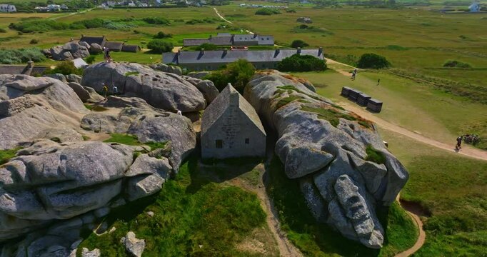 Aerial view of an ancient stone house in the rocks. A mountain village located in the commune of Kerlouan, the Meneham site is located in the heart of the Pagan region, Brittany