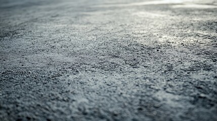 A freshly poured concrete surface forming a smooth finish with a blank space to add text or messaging.