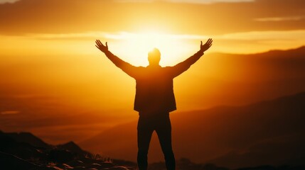 Fototapeta premium Person Embracing Sunrise with Outstretched Arms in Nature