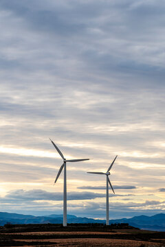 Large wind turbine with rotating blades in Teruel, Spain, symbolizing sustainable technology and progress.