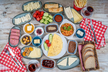 Breakfast table. Traditional Turkish breakfast with various appetizers, snacks, desserts, pastry, meat, hot and cold dishes, and tea. Turkish name is 'Serpme Kahvaltı'