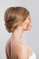 Fototapeta premium Beautiful hairdo, back and head of blond woman