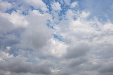 abstract background of white fluffy clouds on a bright blue sky