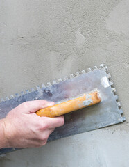 painting a wall with paint roller