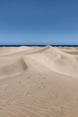 Sandy Dunes Against a Clear Blue Sky