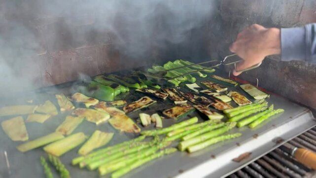 Vegetarian and vegan outdoor barbecue. Grilled peppers, zucchini and asparagus.