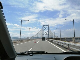 It says "Naruto" in Japanese. In the Naruto Strait, Tokushima Prefecture, Japan, the ocean creates swirling waves due to special tidal currents.