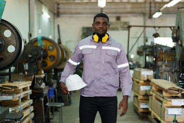 African black male engineer portrait in factory.