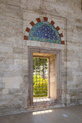 Yavuz Sultan Selim Mosque. window in the garden overlooking the outer courtyard.