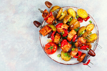 Meat kebab with potatoes.
