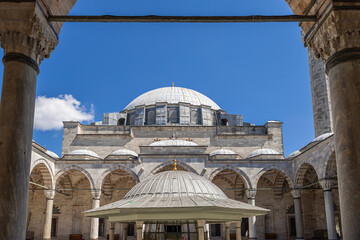 A photo of Yavuz Sultan Selim Mosque in Istanbul, taken from the entrance. The courtyard, domes,...
