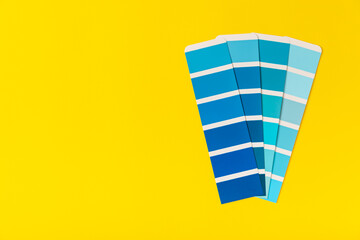 Color palette on a bright colored background. Color palette guide. paper catalog of rainbow color. creative.Palette, samples of trending colors. Color swatches. Decor and interior designer. Top view. 