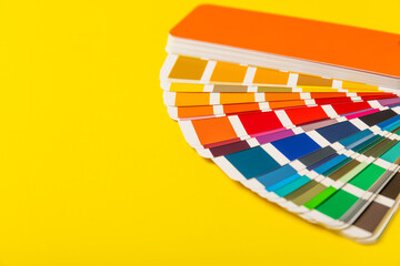 Color palette on a bright colored background. Color palette guide. paper catalog of rainbow color....