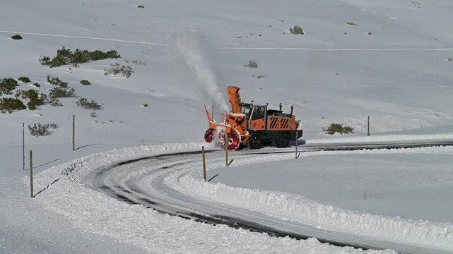 Snow Plow Clearing Heavy Snow. Winter Road Maintenance