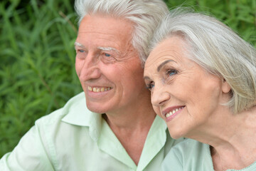 Loving mature couple in the park in summer