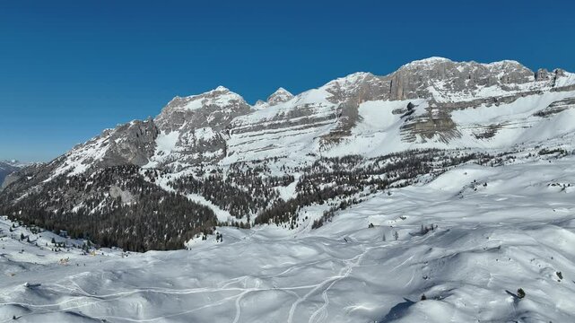 Aerial drone view of sunny winter in dolomites, alps. Spinale and Madonna di Campiglio drone view. Village and a ski resort in Italy. Ursus snowpark in Val Rendena dolomites trentino Italy.