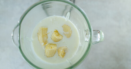 Banana Slices in Blender with Milk, top view