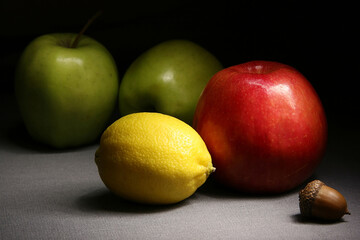 Whole fresh fruits with peels of different colors close-up