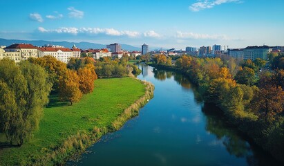 Obraz premium Autumnal river scene with cityscape.