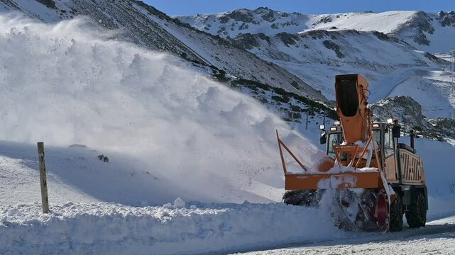Snow Plow Clearing Heavy Snow. Winter Road Maintenance