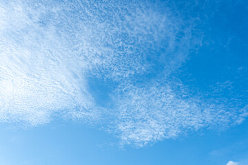 Vibrant Blue Sky with Scattered Cumulus Cloudscape Natural Texture Background